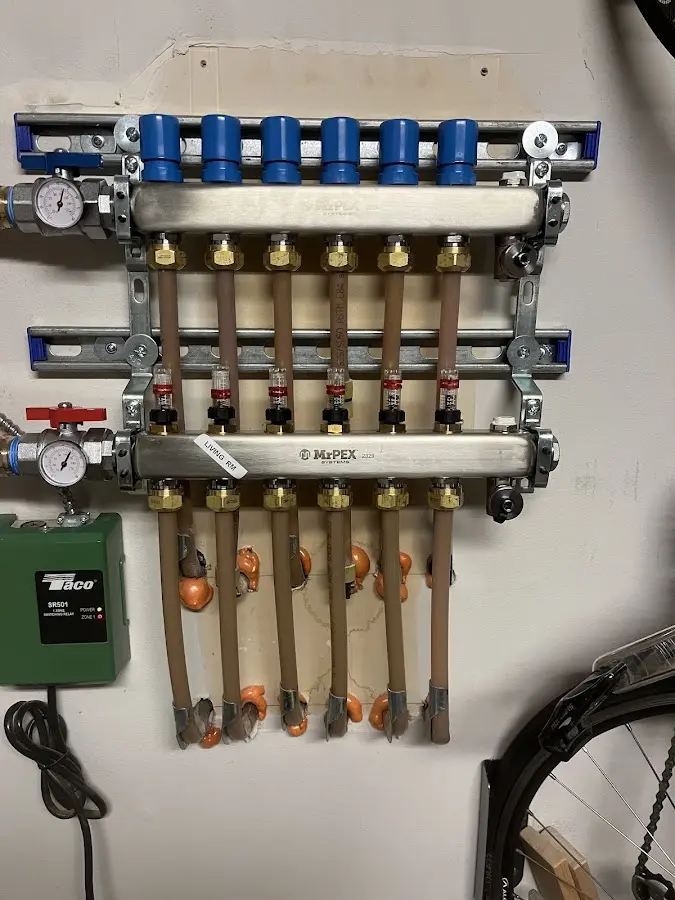 Plumber performing Water Heater Repair at a residential property in Iola